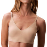 Calvin Klein Invisibles Comfort Lightly Lined Seamless Wireless Triangle Bralette Bra, Bare, Medium